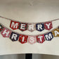 Merry Christmas bunting made with an array of Liberty London Christmas prints