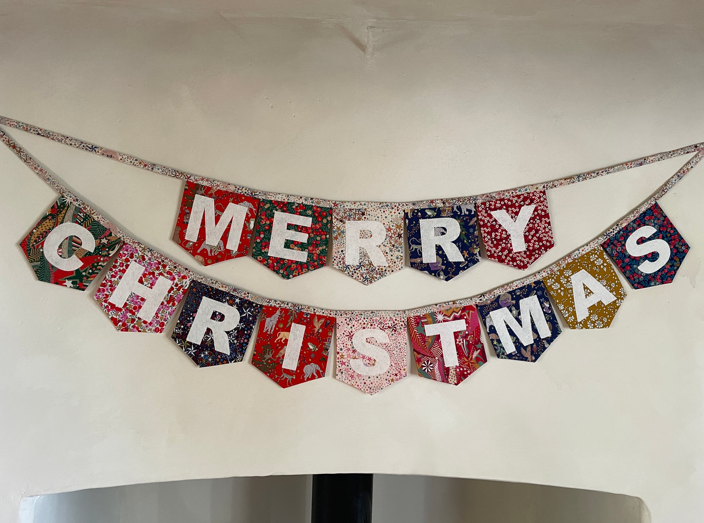 Merry Christmas bunting made with an array of Liberty London Christmas prints