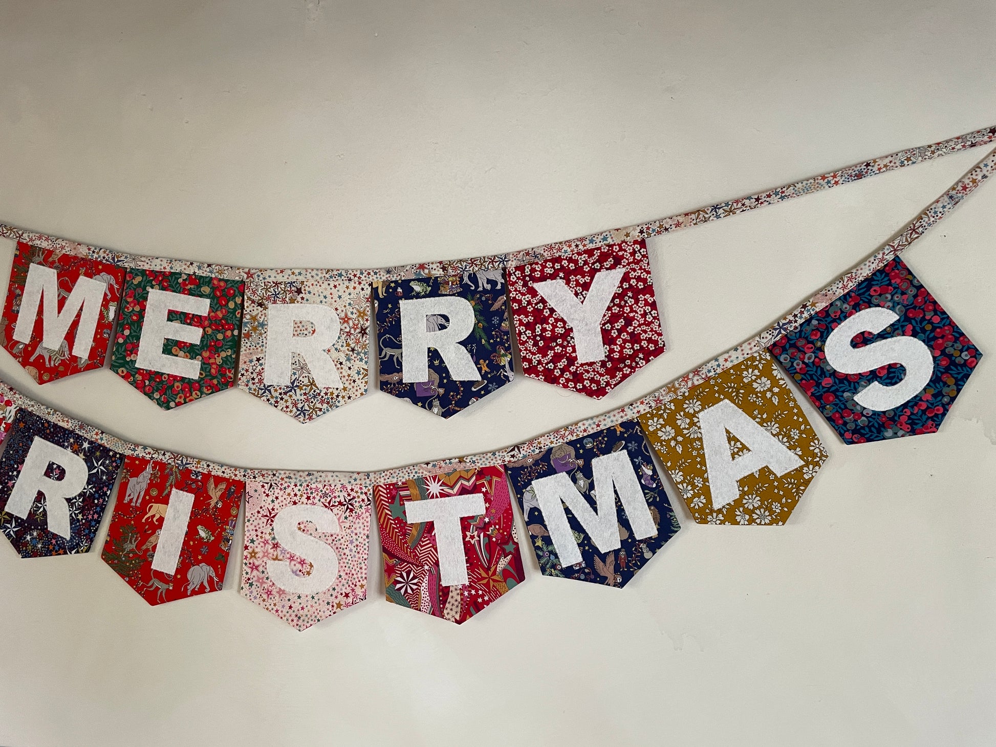 Merry Christmas bunting made with an array of Liberty London Christmas prints