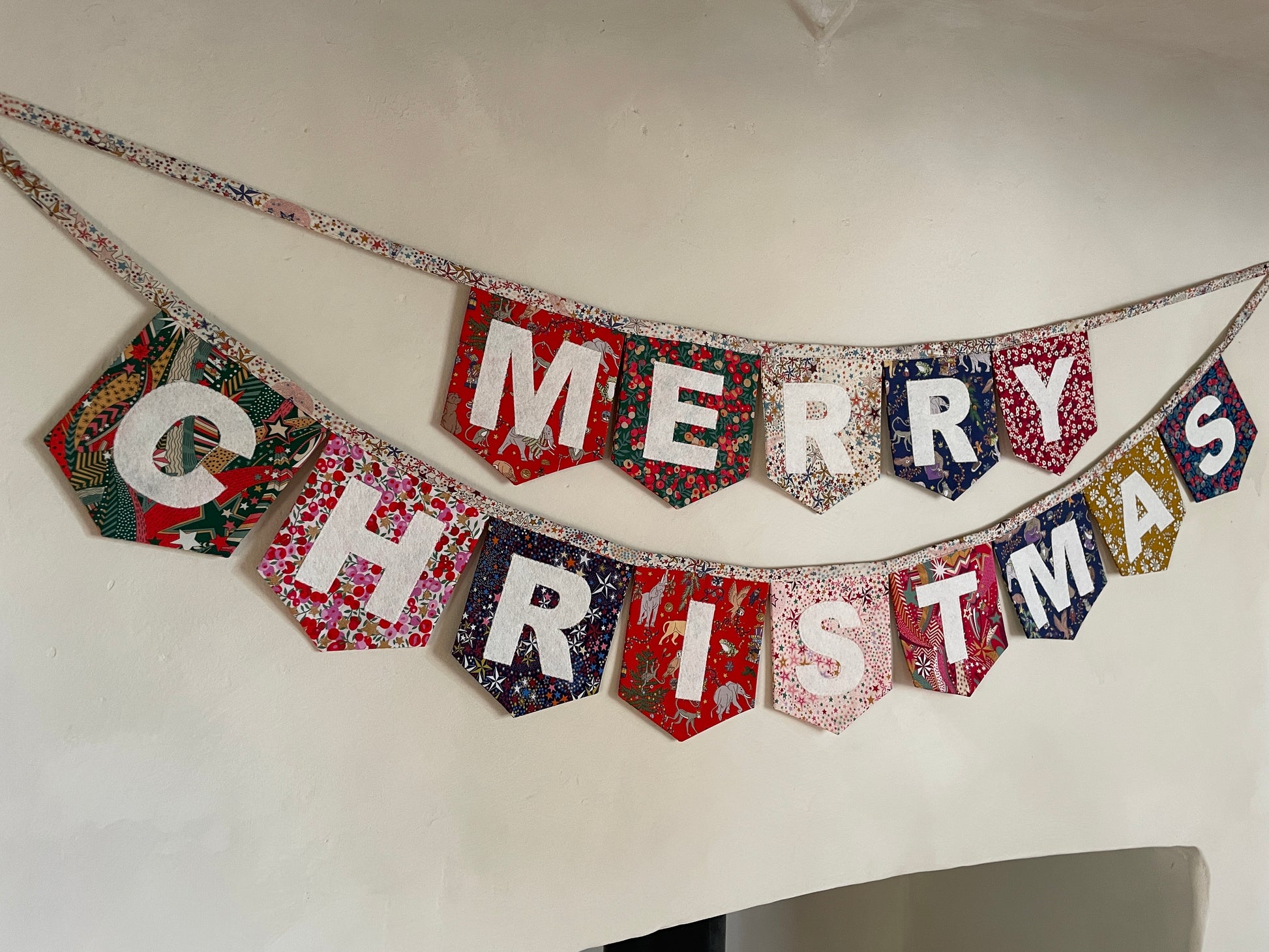 Merry Christmas bunting made with an array of Liberty London Christmas prints