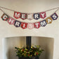 Merry Christmas bunting made with an array of Liberty London Christmas prints