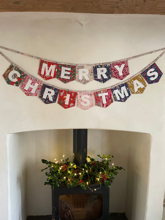 Merry Christmas bunting made with an array of Liberty London Christmas prints