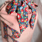 Handcrafted red striped linen Christmas gift sack with monogrammed Liberty print initial